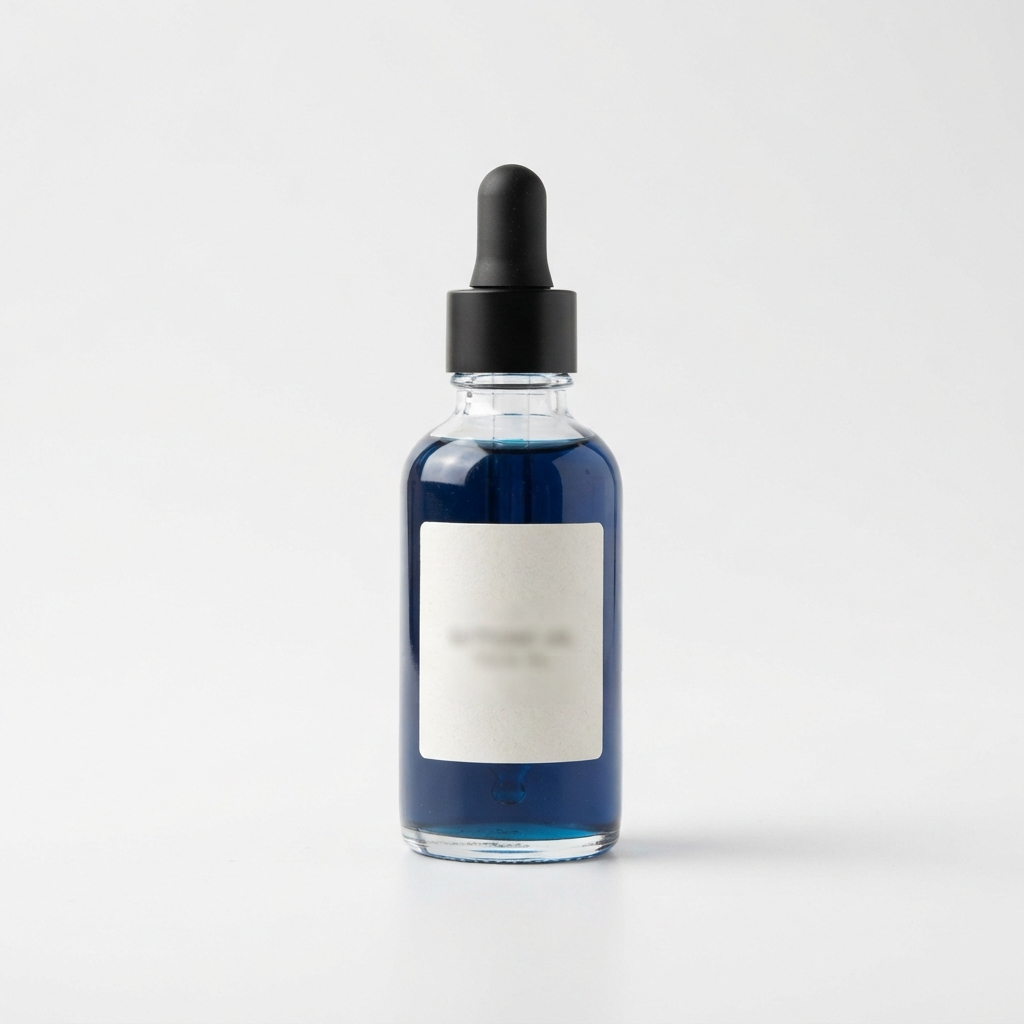 Butterfly-pea facial oil in a dark blue dropper bottle.
