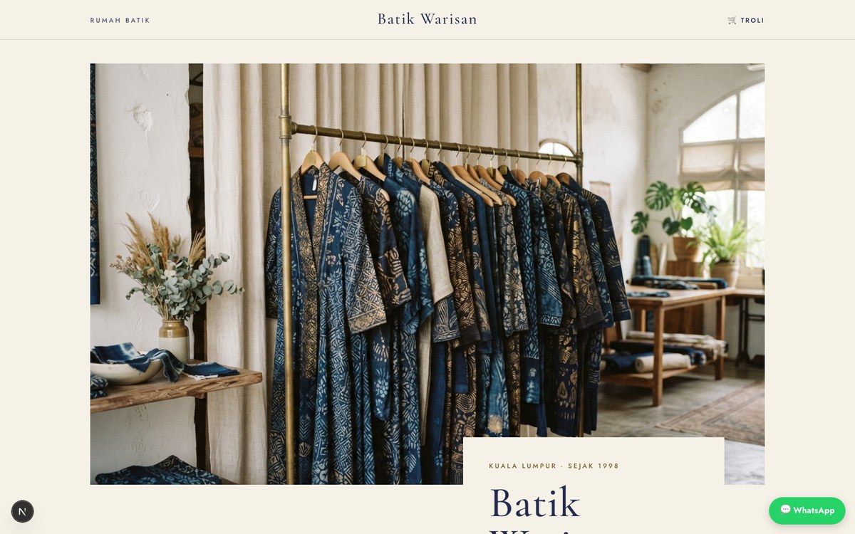 Batik Warisan: an ivory typographic storefront with a rack of indigo batik garments.